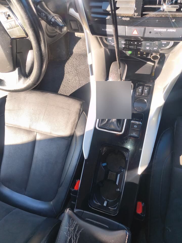 After: clean Mitsubishi SUV center console and cup holders following a Gleam Team interior detail in Charlotte and Raleigh NC